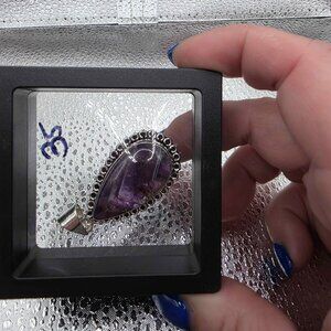 teardrop-shaped amethyst gemstone pendant handcrafted in 925 sterling silver